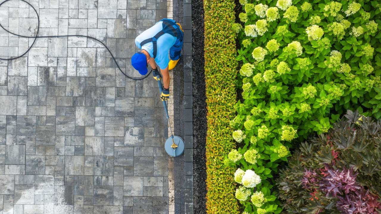 Pressure Washing a sidewalk