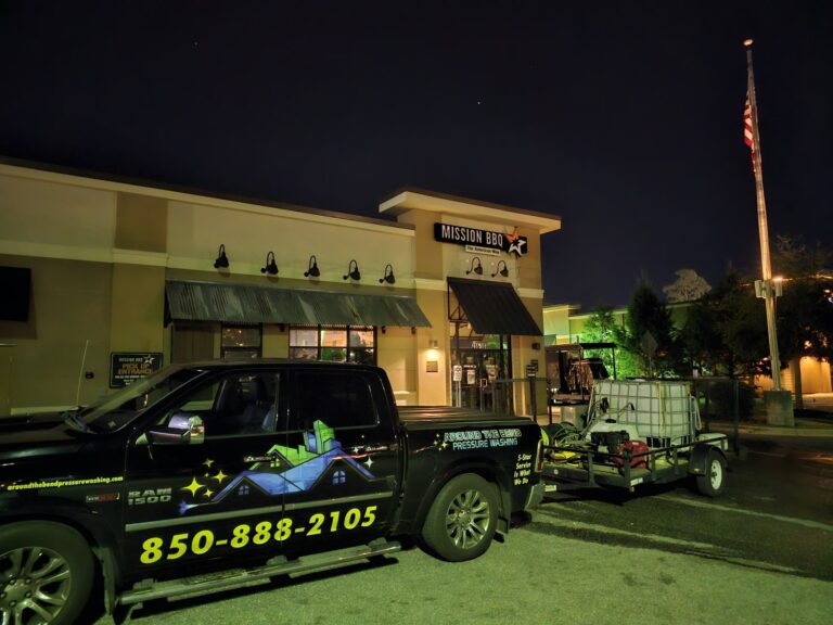 Branded pressure washing truck and trailer at commercial job site in Tallahassee, FL