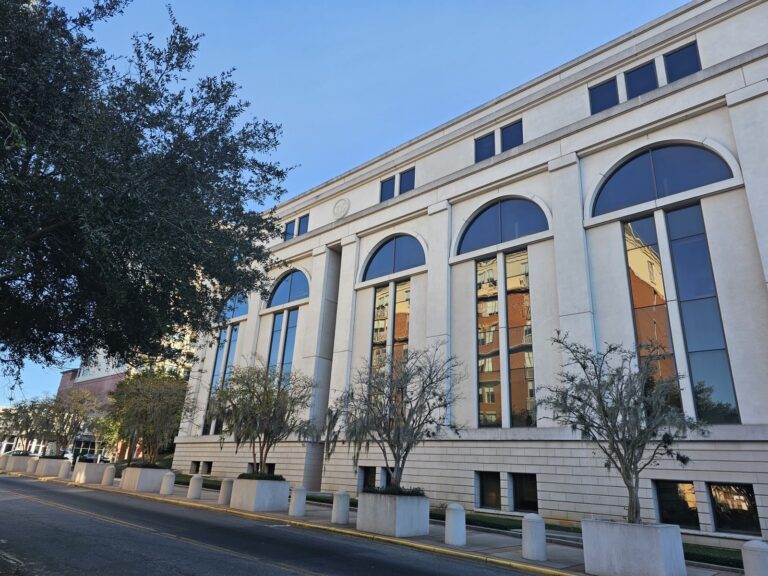 Clean white commercial building exterior after pressure washing in Tallahassee, FL