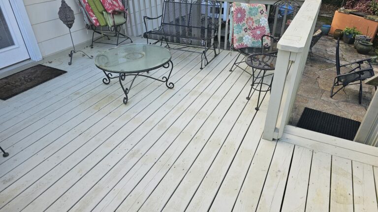 Clean white wood deck after pressure washing in Tallahassee, FL