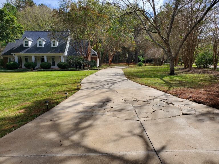 Clean concrete driveway leading to residential home after washing in Tallahassee, FL