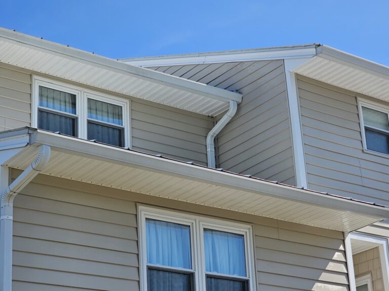 Clean vinyl siding gutters and soffit after washing in Panacea, FL