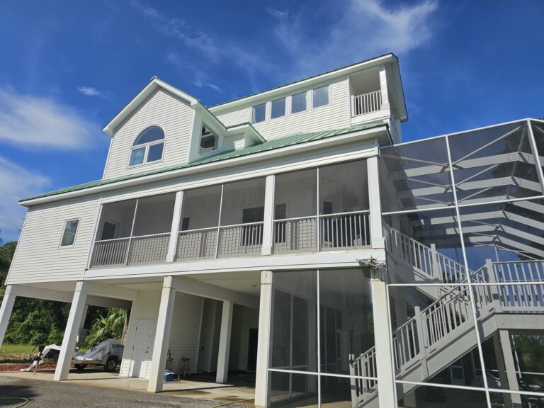 Clean white coastal home exterior after house washing in Carrabelle, FL