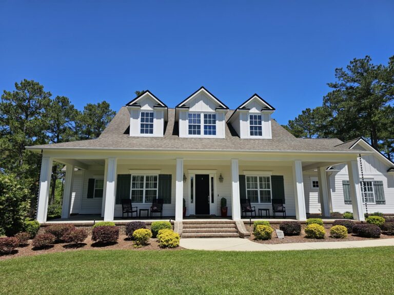 Clean white home exterior after soft washing service in Tallahassee, FL