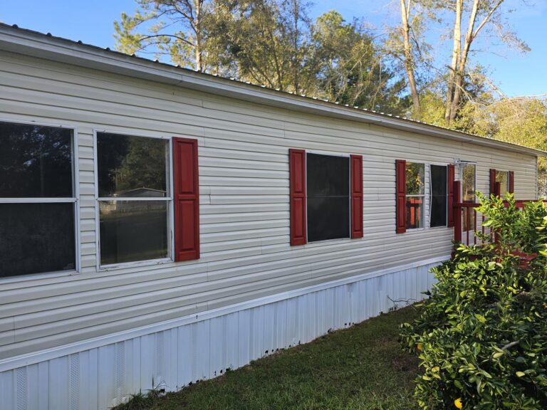 Clean mobile home siding after soft wash treatment in Tallahassee, FL