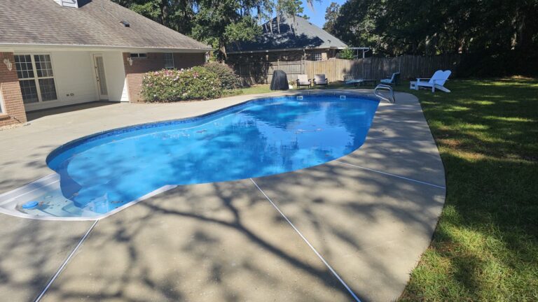 Clean concrete pool deck after pressure washing in Crawfordville, FL