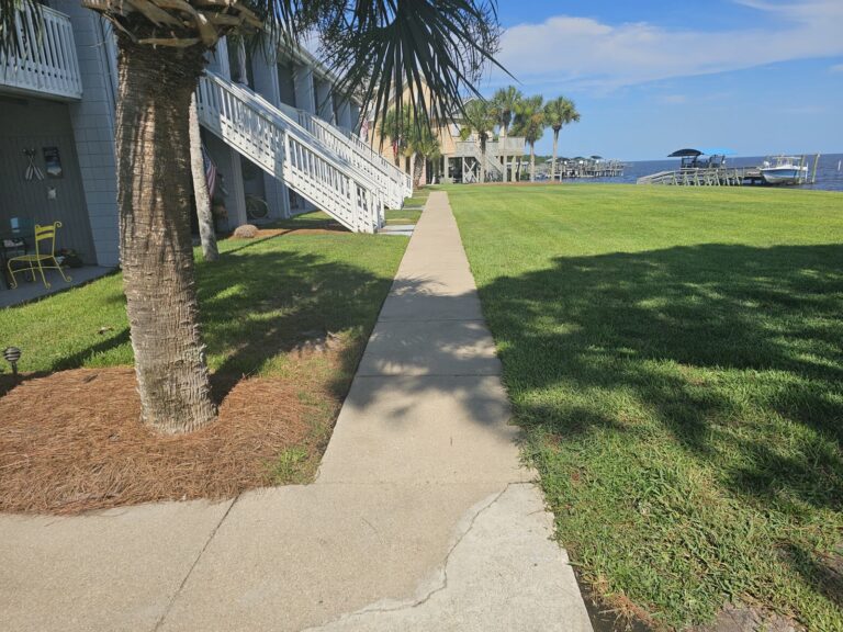 Sidewalk-Patio Cleaning 7 Clean concrete sidewalk after pressure washing near waterfront in Panacea, FL