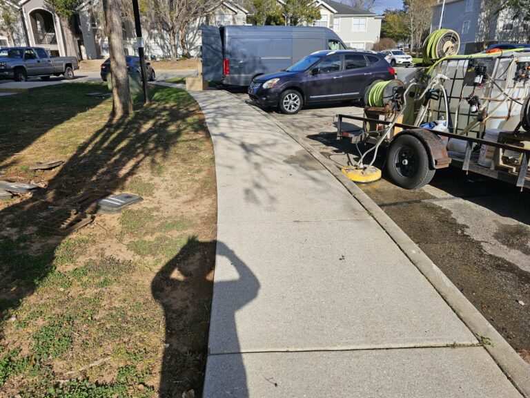 Sidewalk-Patio Cleaning 2 Clean concrete sidewalk after pressure washing with equipment in Tallahassee, FL