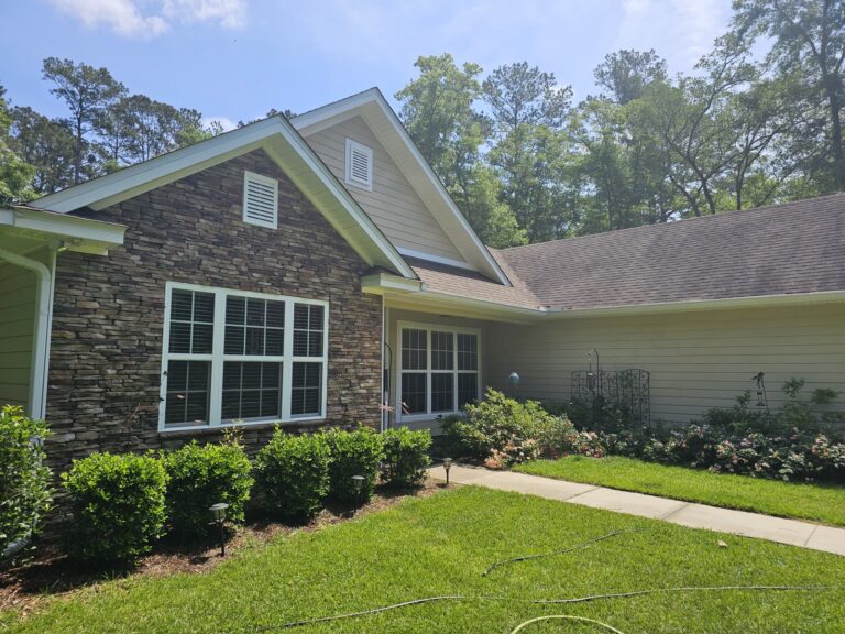 Lafayette Oaks & Midyette Plantation Washing Services 1 Clean home exterior with stone facade after house wash in Lafayette Oaks, Tallahassee, FL
