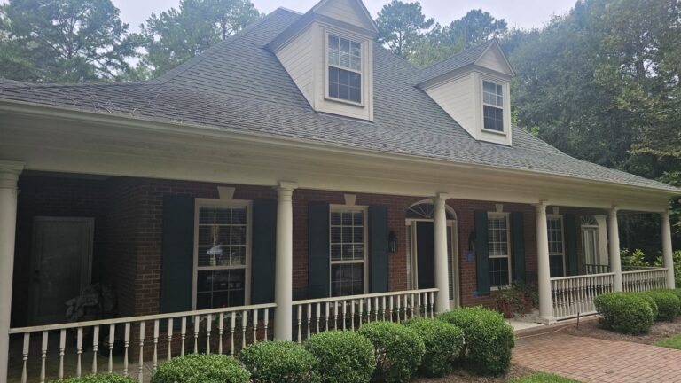 Rosehill and Bobbin Brook Pressure Washing Services 1 Clean brick home exterior with white wrap-around porch in Rosehill, Tallahassee, FL