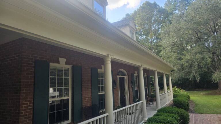 Rosehill and Bobbin Brook Pressure Washing Services 3 Clean brick home exterior with white porch columns after washing in Rosehill, Tallahassee, FL