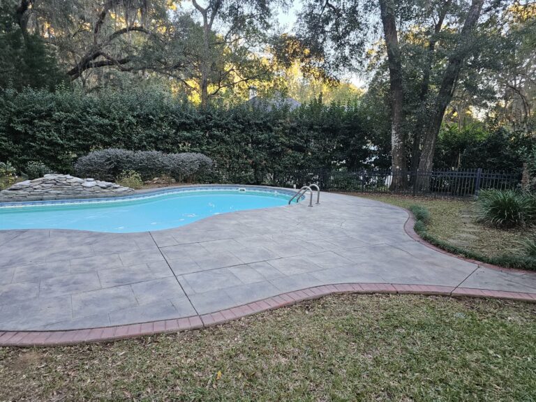 Clean stamped concrete pool deck after pressure washing in Summerbrooke, Tallahassee, FL