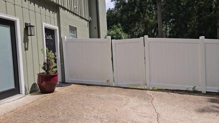 Clean concrete pad and vinyl fence after washing in Waverly Hills, Tallahassee, FL