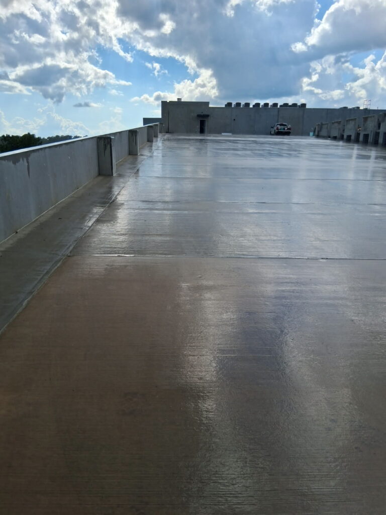 Clean upper deck of a new parking garage after post-construction cleaning in Tallahassee, FL